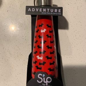 Sip be S’well red and black Scotty water bottle.